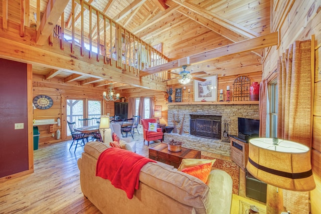 living room featuring a stone fireplace, wooden ceiling, light wood-type flooring, wooden walls, and beamed ceiling