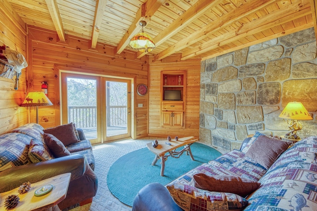 living room with beam ceiling, carpet floors, wooden ceiling, and wooden walls