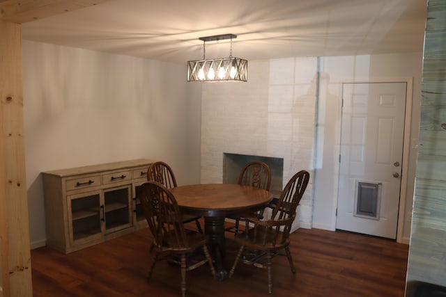 606 Caton St, Seymour, TN 37865 - dining area featuring dark wood-type flooring and a fireplace