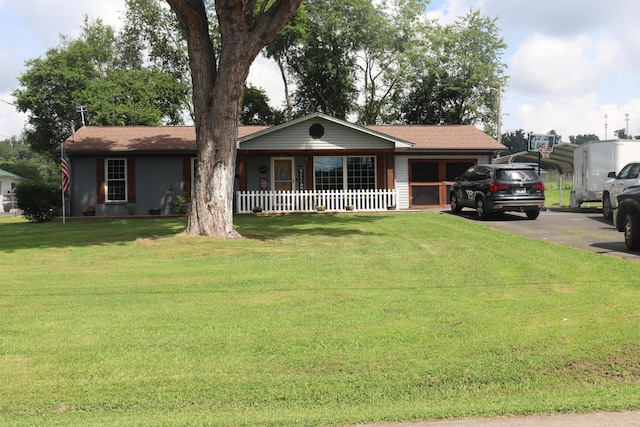 606 Caton St, Seymour, TN 37865 - single story home with covered porch, a front yard, a carport, and roof with shingles