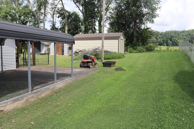 606 Caton St, Seymour, TN 37865 - view of yard with a shed, a carport, and a patio