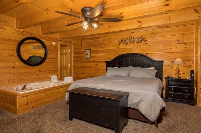 2040 Cougar Crossing Way, Sevierville, TN 37862 - carpeted bedroom with beam ceiling, wooden ceiling, and wood walls