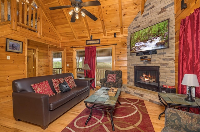 2040 Cougar Crossing Way, Sevierville, TN 37862 - living room featuring a fireplace, wood walls, wooden ceiling, beamed ceiling, and hardwood / wood-style flooring