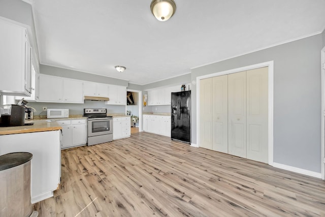 1439 Woods Ridge Rd, Dandridge, TN 37725 - kitchen with black refrigerator with ice dispenser, stainless steel range with electric stovetop, white microwave, under cabinet range hood, and light countertops