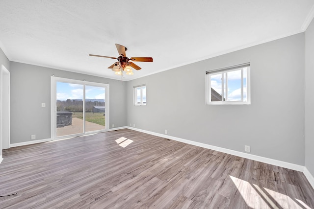 1439 Woods Ridge Rd, Dandridge, TN 37725 - spare room featuring wood finished floors, ceiling fan, and ornamental molding