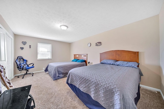 1439 Woods Ridge Rd, Dandridge, TN 37725 - carpeted bedroom featuring a textured ceiling and baseboards
