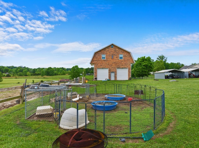 1439 Woods Ridge Rd, Dandridge, TN 37725 - view of yard with a garage, an outbuilding, and a fire pit
