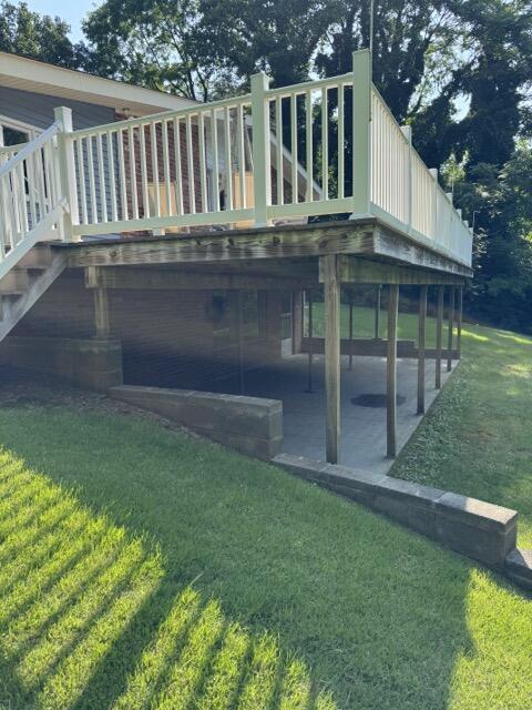 2414 Woodchuck Dell, Morristown, TN 37814 - back of property with a patio, a lawn, a deck, and stairway