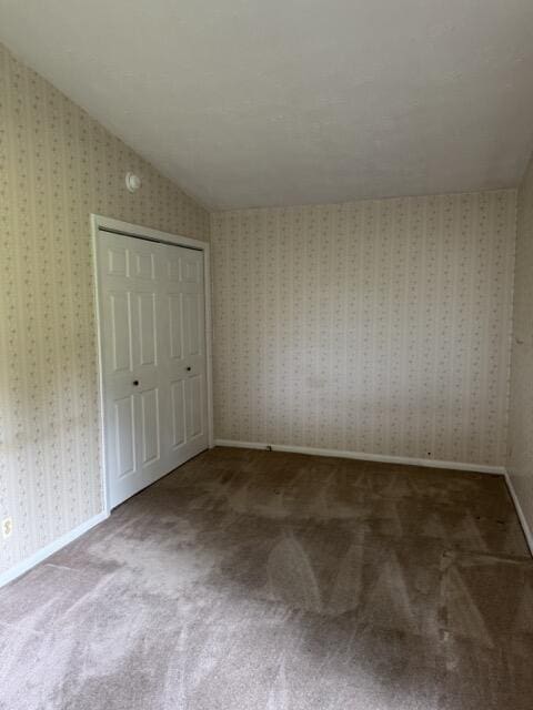2414 Woodchuck Dell, Morristown, TN 37814 - unfurnished bedroom with lofted ceiling, carpet flooring, and a closet