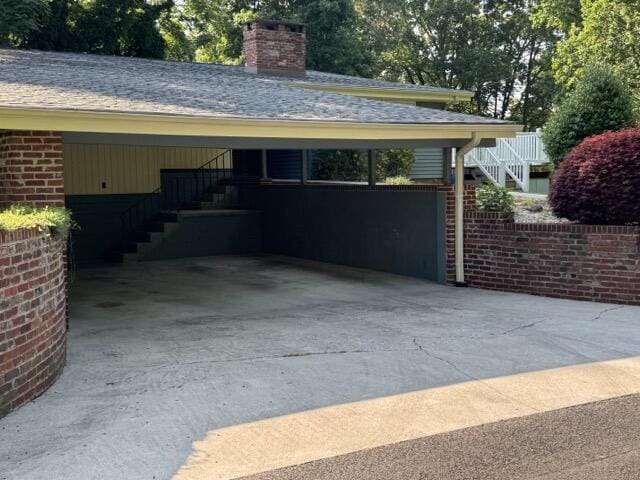 2414 Woodchuck Dell, Morristown, TN 37814 - garage with driveway and a carport