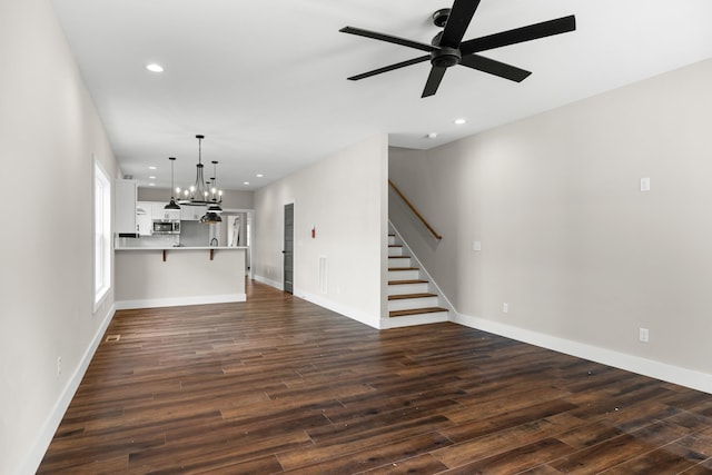 274A W Main St, Dandridge, TN 37725 - unfurnished living room with ceiling fan, a chandelier, stairway, dark wood-style flooring, and recessed lighting