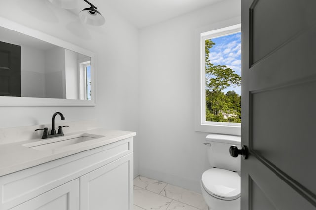 274A W Main St, Dandridge, TN 37725 - bathroom featuring toilet, marble look tile flooring, vanity, and baseboards
