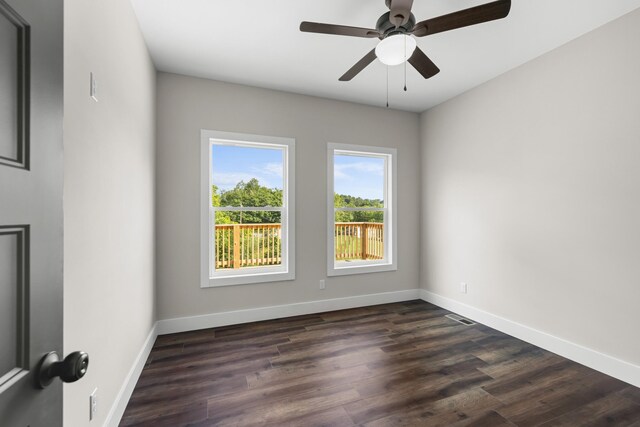 274A W Main St, Dandridge, TN 37725 - spare room with baseboards, dark wood finished floors, and a ceiling fan