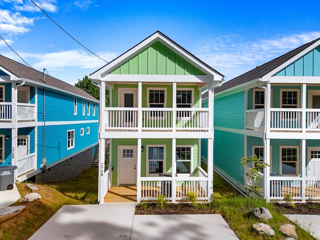 274A W Main St, Dandridge, TN 37725 - view of front of property featuring a porch, board and batten siding, a balcony, and stairs