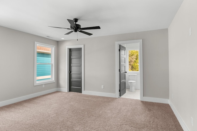274A W Main St, Dandridge, TN 37725 - unfurnished bedroom with light colored carpet, baseboards, ensuite bath, a closet, and ceiling fan