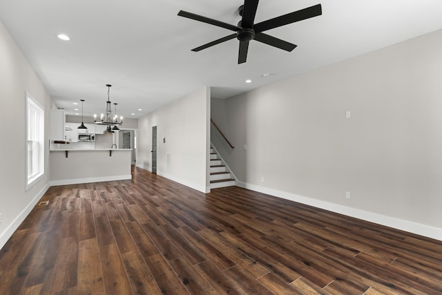 274A W Main St, Dandridge, TN 37725 - unfurnished living room with stairway, dark wood-type flooring, recessed lighting, a chandelier, and ceiling fan