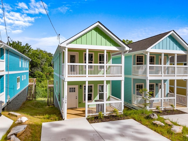 274A W Main St, Dandridge, TN 37725 - view of front of house with a porch, board and batten siding, a balcony, and stairway