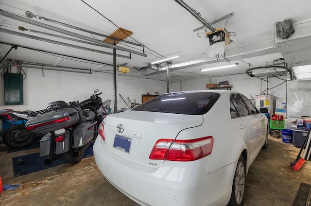 591 Phyllis Cir, Talbott, TN 37877 - garage featuring electric panel, water heater, and a garage door opener