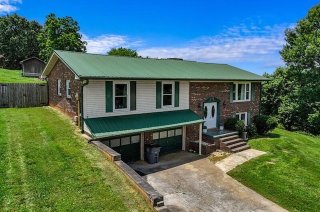 591 Phyllis Cir, Talbott, TN 37877 - bi-level home with an attached garage, a metal roof, concrete driveway, and brick siding