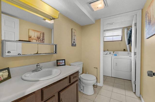 591 Phyllis Cir, Talbott, TN 37877 - full bath featuring independent washer and dryer, tile patterned flooring, vanity, and a bath