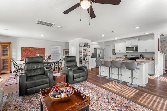 2909 Nicole Cir, Morristown, TN 37814 - living area featuring ceiling fan, dark wood-type flooring, recessed lighting, and crown molding