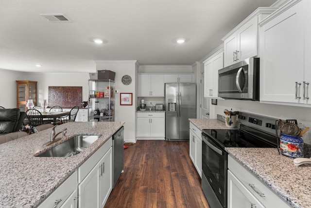 2909 Nicole Cir, Morristown, TN 37814 - kitchen featuring stainless steel appliances, a sink, recessed lighting, white cabinetry, and dark wood-style floors