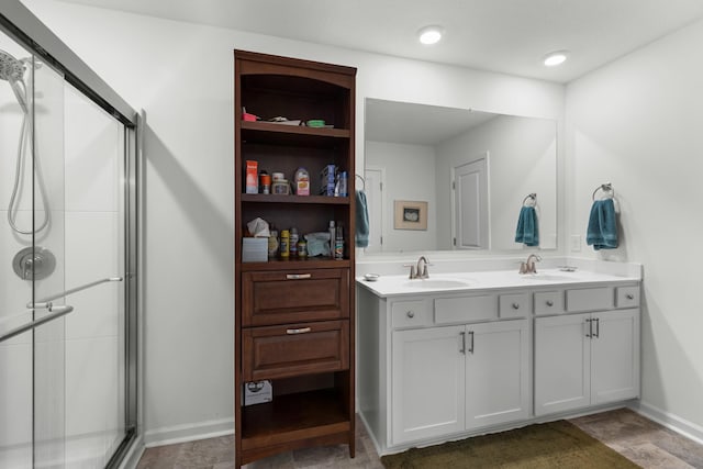 2909 Nicole Cir, Morristown, TN 37814 - full bathroom featuring a stall shower, double vanity, and baseboards