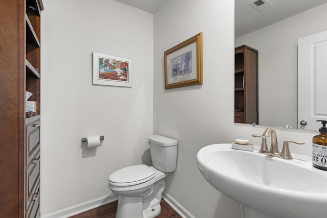 2909 Nicole Cir, Morristown, TN 37814 - half bath with a sink, toilet, wood finished floors, and baseboards