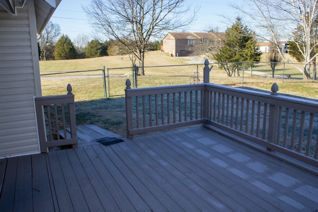 wooden deck featuring a yard