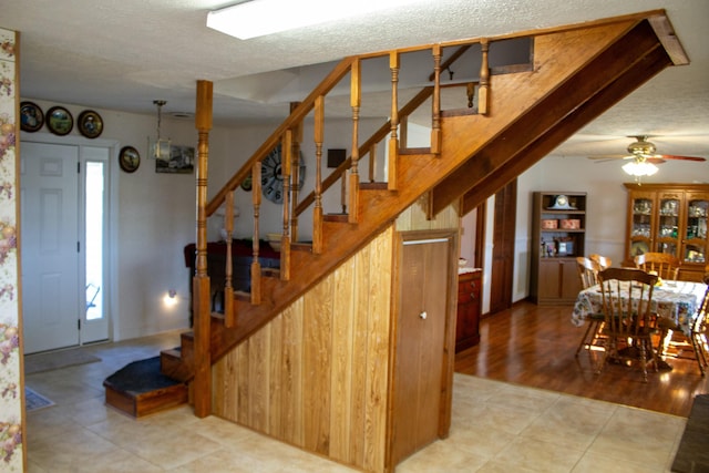 interior space featuring tile patterned floors and a textured ceiling