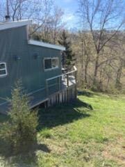 view of side of property featuring a lawn