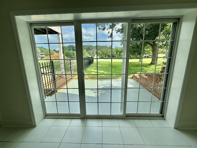 doorway with light tile patterned floors