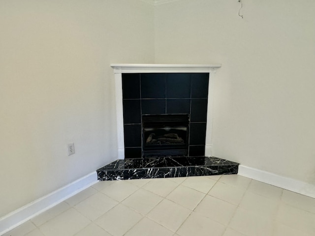 room details featuring a tiled fireplace