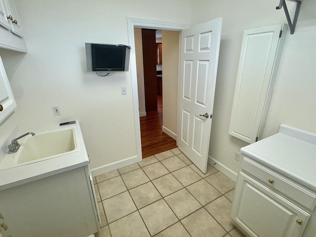 bathroom featuring tile patterned flooring and sink