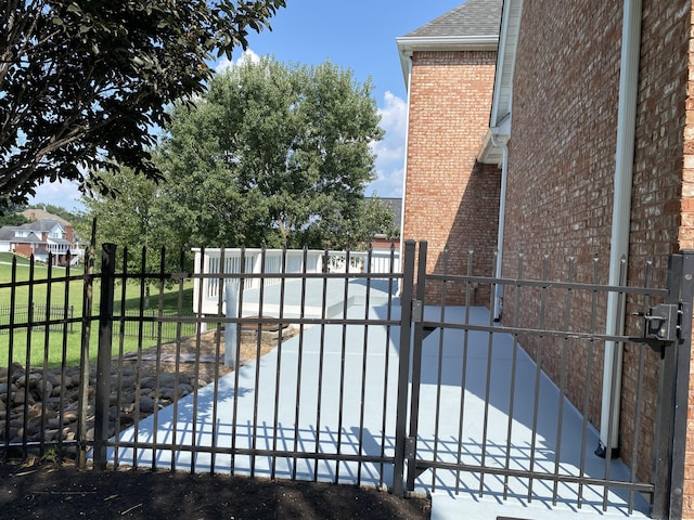 view of gate with fence