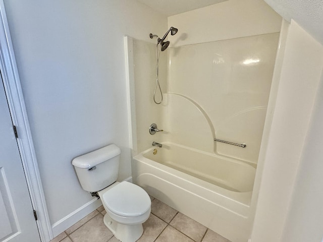 bathroom featuring tile patterned flooring, bathtub / shower combination, a textured ceiling, and toilet