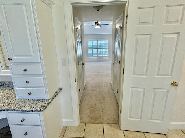 corridor with light colored carpet