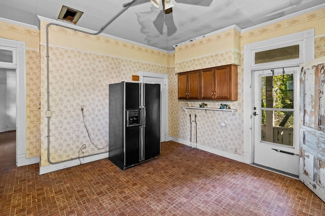 115 E Meeting St, Dandridge, TN 37725 - kitchen with black fridge, brick patterned floors, wallpapered walls, a ceiling fan, and brown cabinets