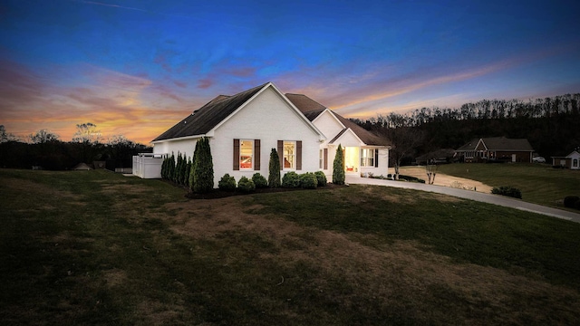 modern farmhouse featuring a lawn