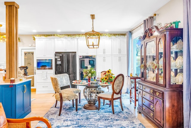 dining space featuring light hardwood / wood-style floors
