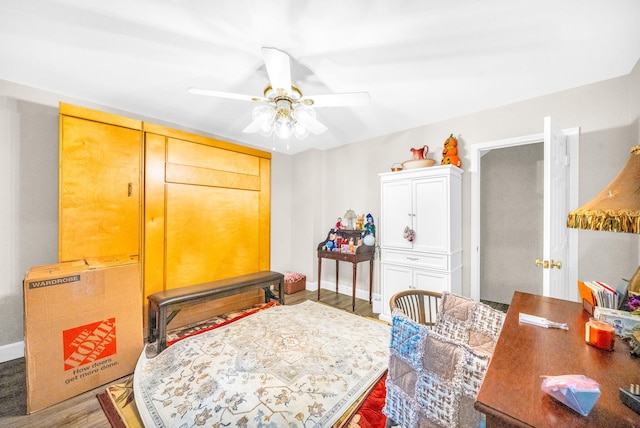 bedroom with ceiling fan and wood-type flooring