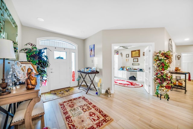 entrance foyer with hardwood / wood-style flooring and ceiling fan
