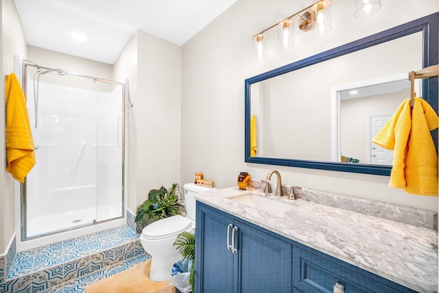 bathroom with toilet, vanity, tile patterned floors, and an enclosed shower