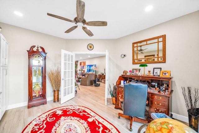 office area with ceiling fan, light hardwood / wood-style flooring, and french doors