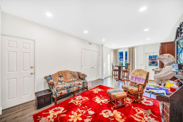 living area with hardwood / wood-style floors