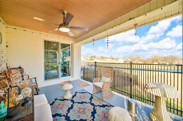 exterior space featuring ceiling fan