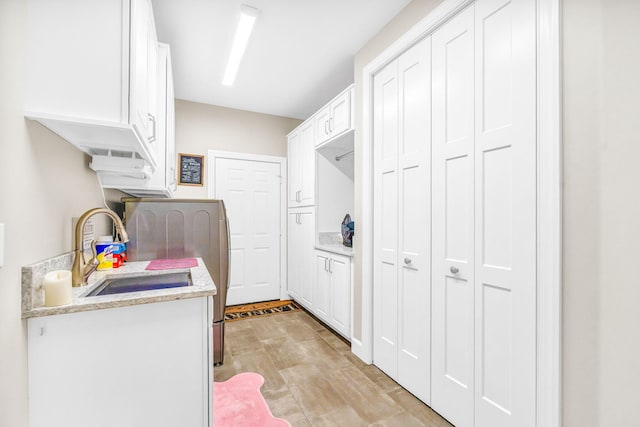 laundry area with sink