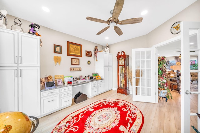 recreation room with ceiling fan, light hardwood / wood-style flooring, built in desk, and french doors