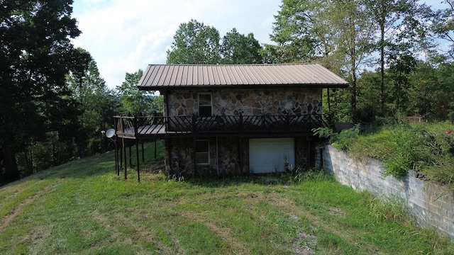 back of property featuring a garage