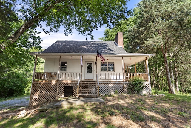 141 Moore Hollow Rd, Newport, TN 37821 - view of front facade featuring a porch, a chimney, and roof with shingles